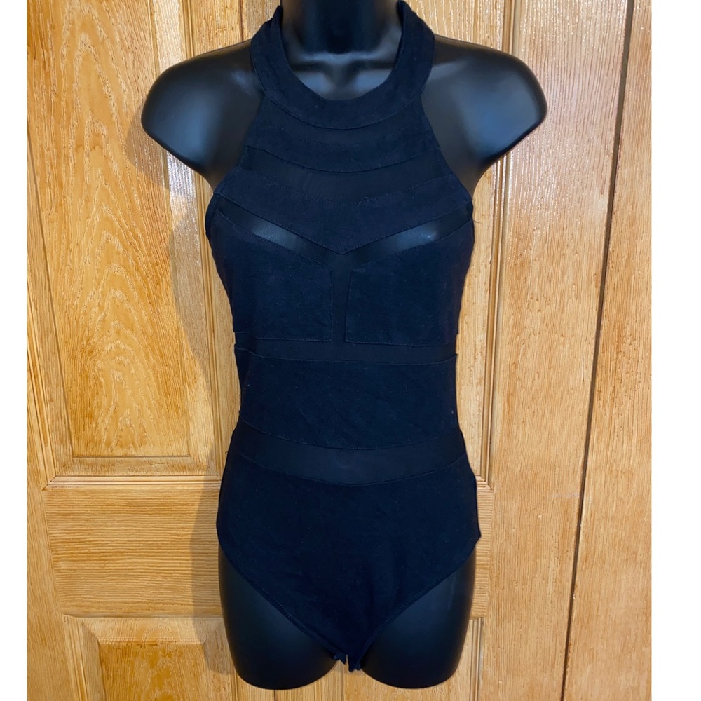 Black body suit. Sheer cut outs.